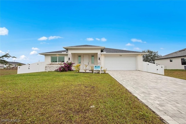 view of front of property featuring a garage and a front yard