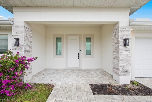 property entrance featuring a garage