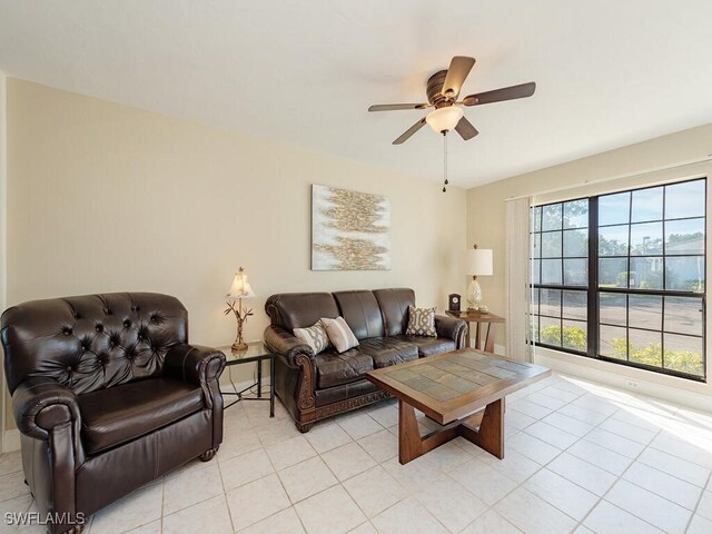 living room featuring light tile patterned floors and ceiling fan