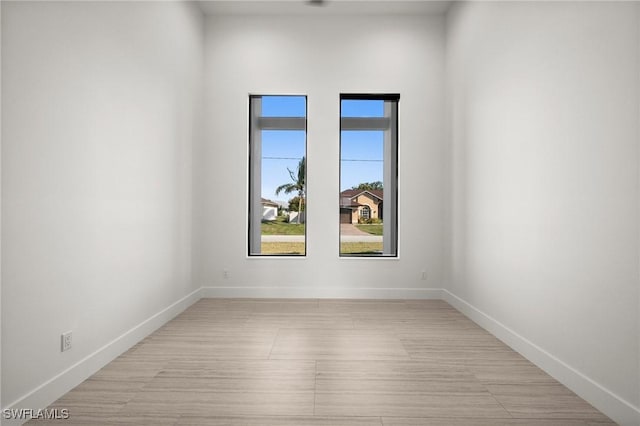 unfurnished room featuring light hardwood / wood-style flooring