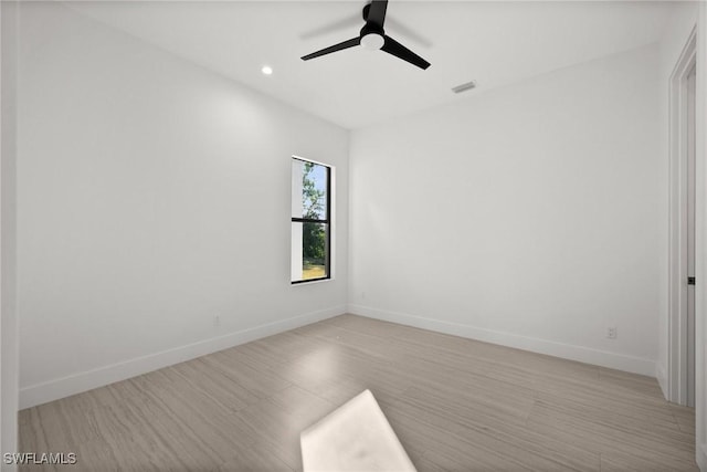 unfurnished room with ceiling fan