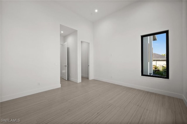 spare room with light hardwood / wood-style floors