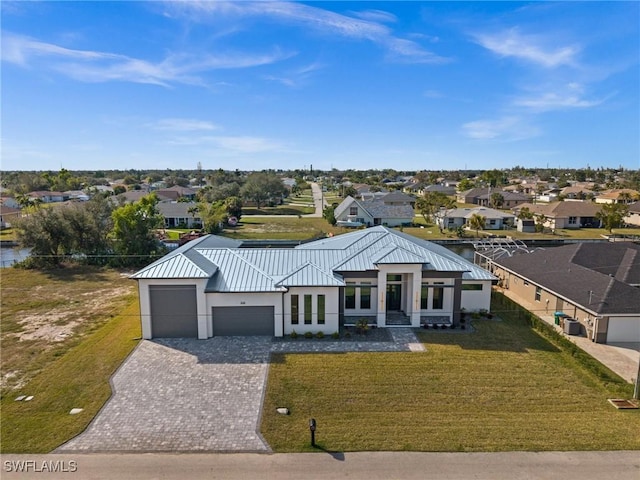 modern farmhouse style home with a garage and a front lawn