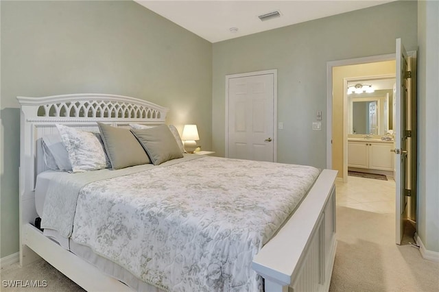 bedroom with light colored carpet