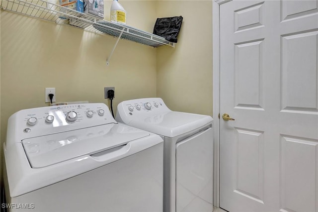 clothes washing area featuring washer and dryer