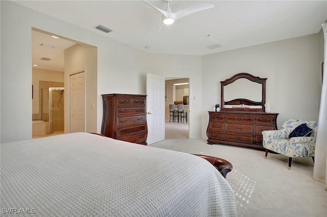 carpeted bedroom featuring ceiling fan and ensuite bathroom