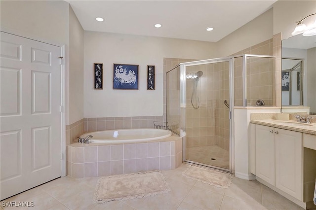 bathroom featuring tile patterned floors, separate shower and tub, and vanity