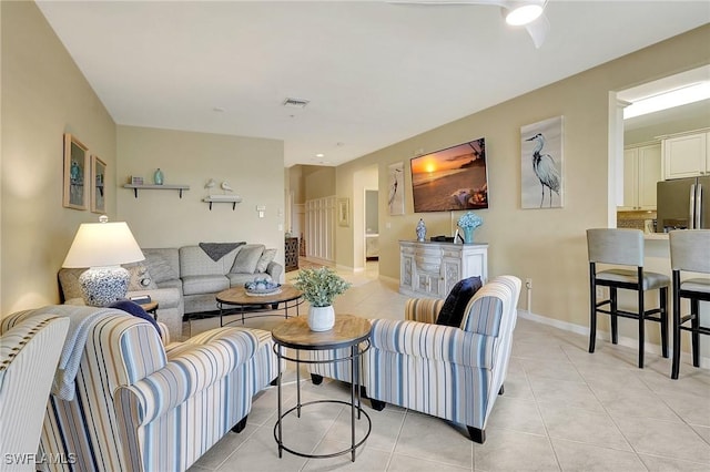 living room with light tile patterned flooring