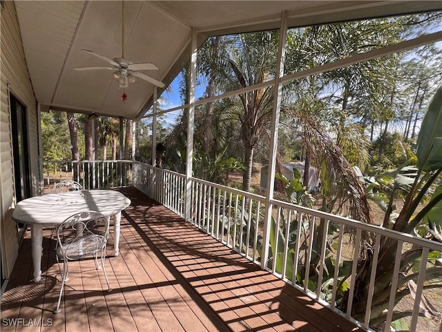 wooden terrace featuring ceiling fan