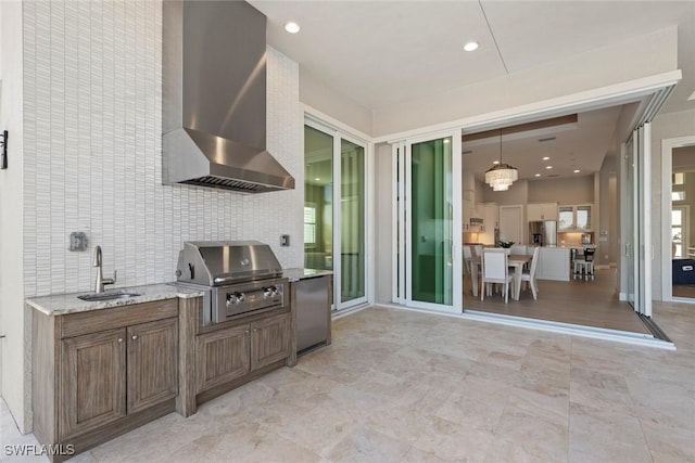 view of patio featuring a grill, sink, and exterior kitchen