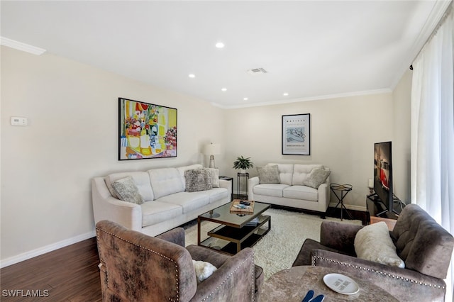 living room with wood-type flooring and crown molding