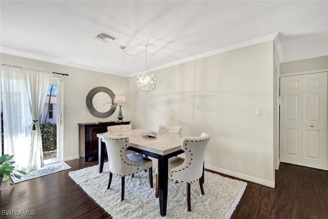 dining room featuring ornamental molding, a chandelier, and dark hardwood / wood-style flooring