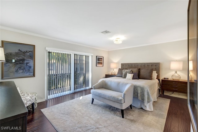 bedroom with crown molding, dark hardwood / wood-style flooring, and access to outside