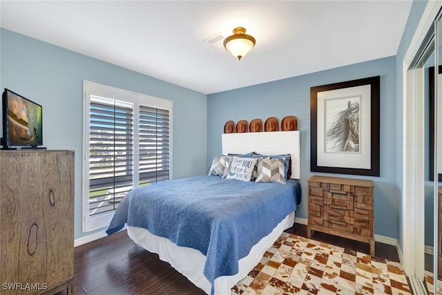 bedroom with hardwood / wood-style floors