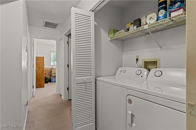 washroom featuring light colored carpet and independent washer and dryer