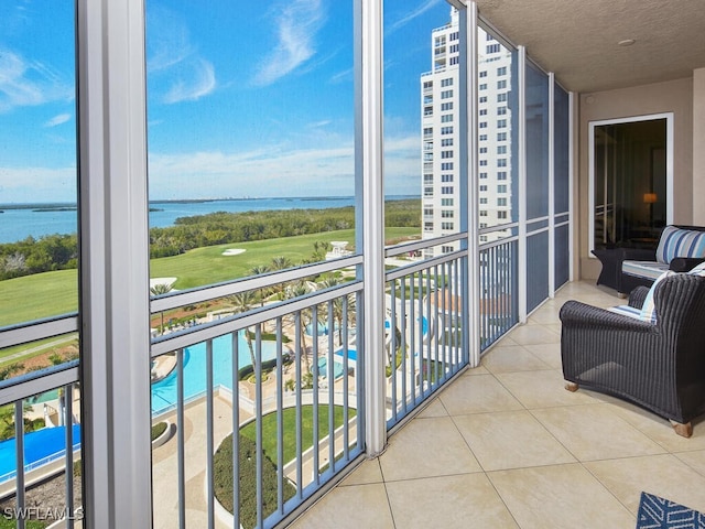 balcony featuring a water view