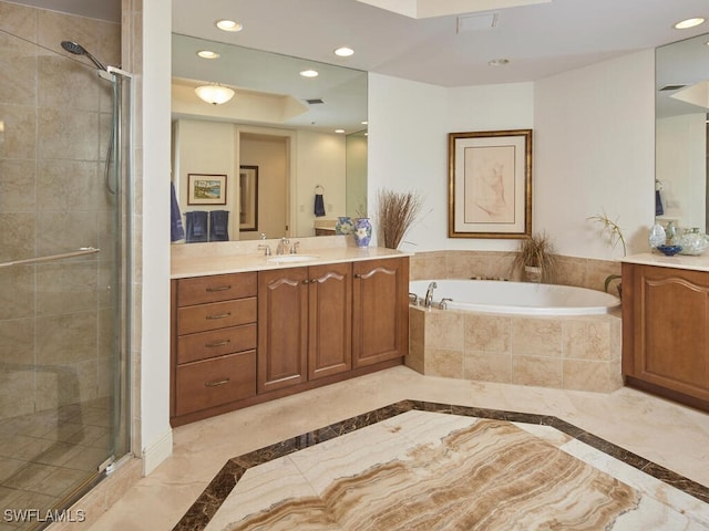 bathroom featuring vanity and plus walk in shower