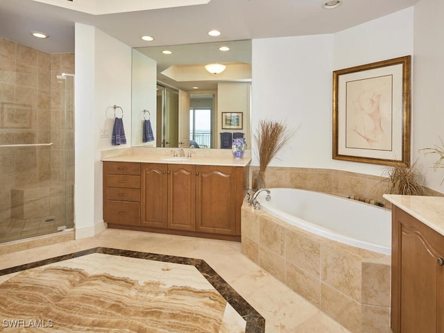 bathroom featuring vanity and separate shower and tub