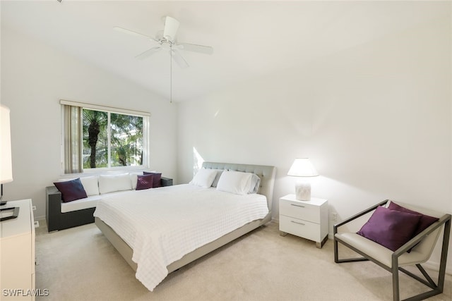 bedroom with lofted ceiling, light colored carpet, and ceiling fan