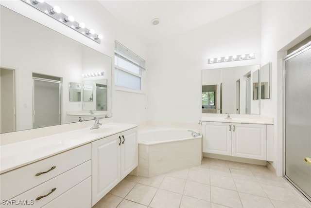 bathroom featuring vanity, separate shower and tub, and tile patterned floors