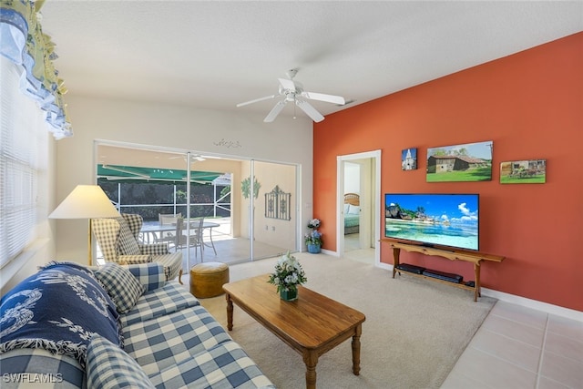 living room with tile patterned floors and ceiling fan