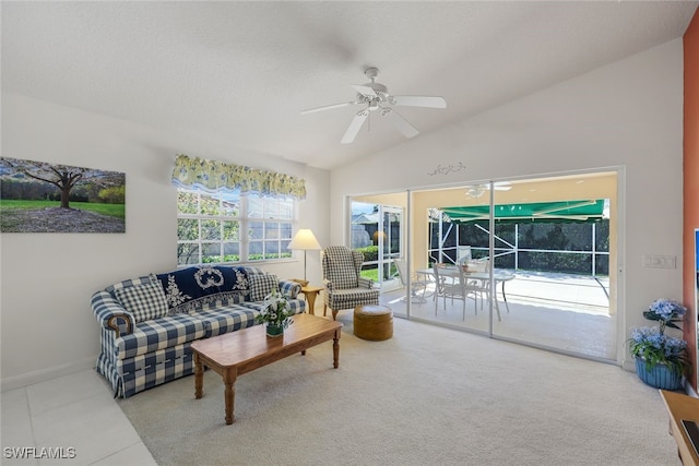 living room with ceiling fan and lofted ceiling