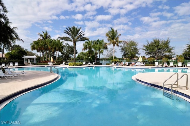 view of pool with a patio and a pergola