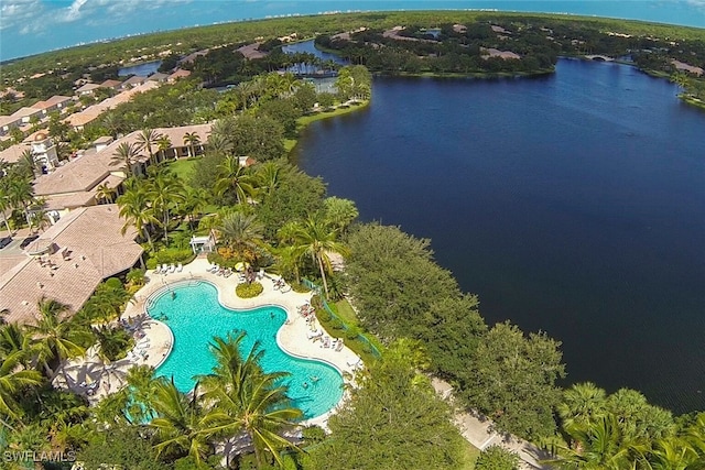 birds eye view of property with a water view