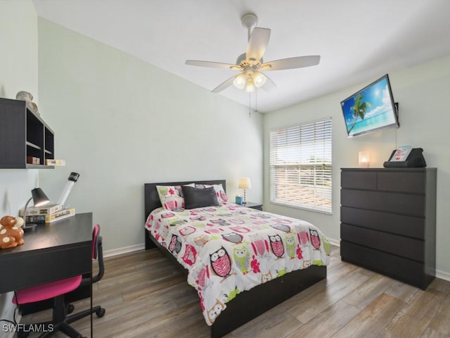 bedroom with hardwood / wood-style floors and ceiling fan