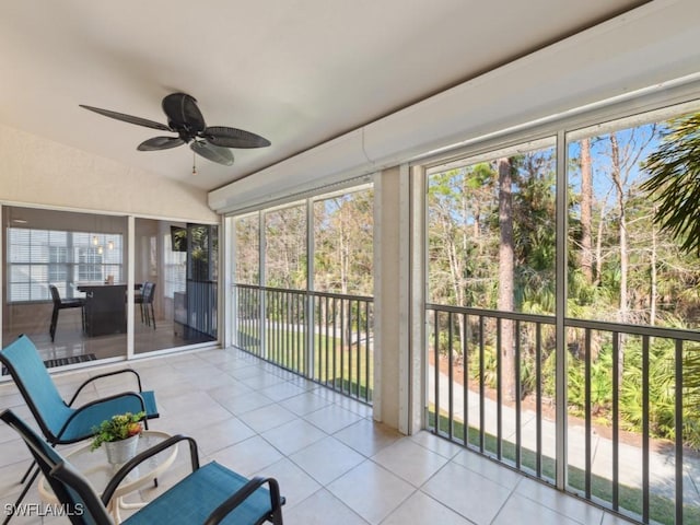 sunroom / solarium featuring vaulted ceiling and ceiling fan