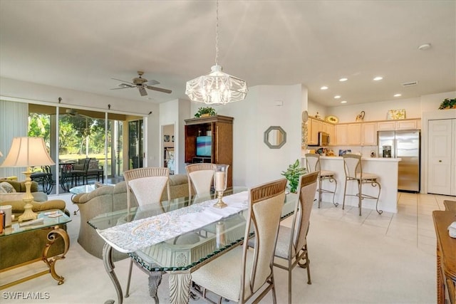 dining room featuring ceiling fan and light tile patterned floors