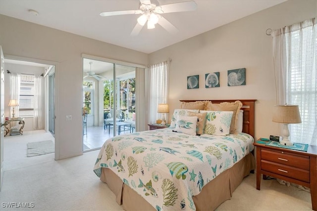 bedroom featuring ceiling fan, light colored carpet, and access to outside