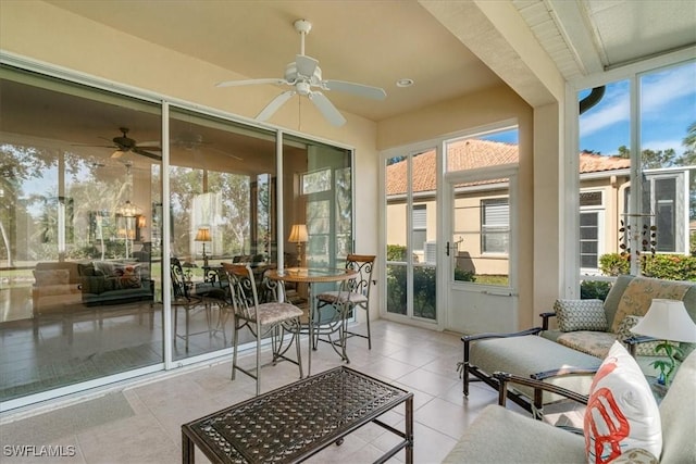 sunroom with plenty of natural light and ceiling fan