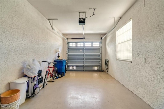 garage featuring a garage door opener