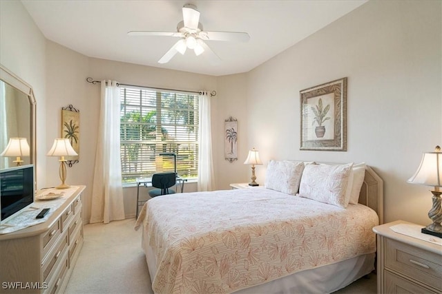 carpeted bedroom with ceiling fan and multiple windows