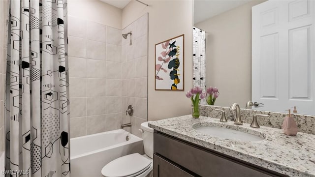 bathroom with toilet, shower / bath combo, and vanity