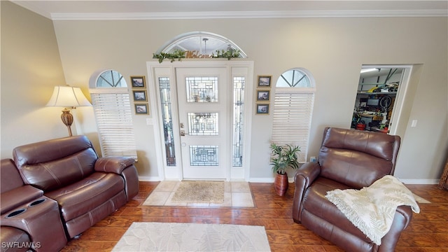 entrance foyer with hardwood / wood-style flooring and crown molding