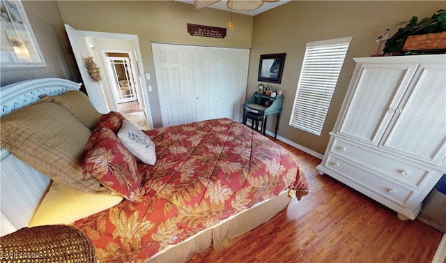 bedroom with wood-type flooring and a closet