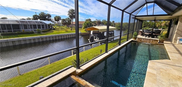 view of pool with a water view, glass enclosure, and a patio area