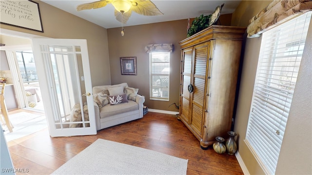 sitting room featuring hardwood / wood-style flooring and ceiling fan