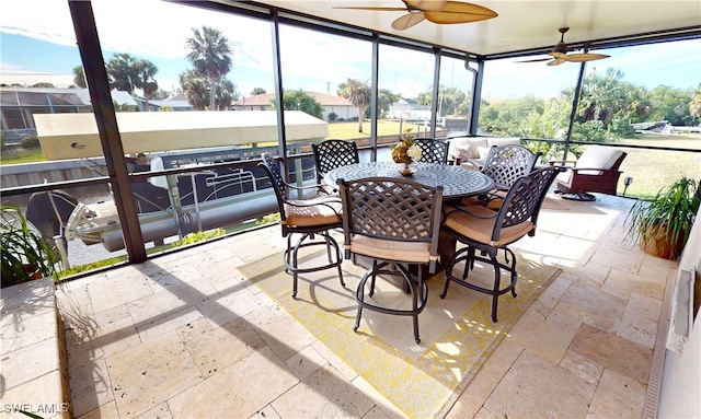 sunroom with ceiling fan