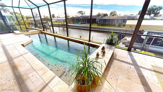 view of swimming pool with an in ground hot tub, a patio, glass enclosure, and a water view