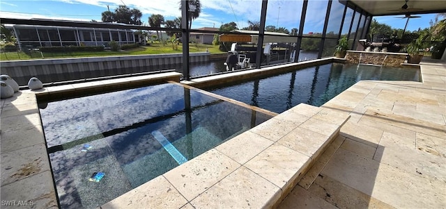 view of swimming pool with a water view