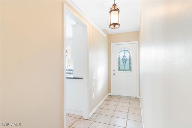 doorway featuring light tile patterned flooring and sink