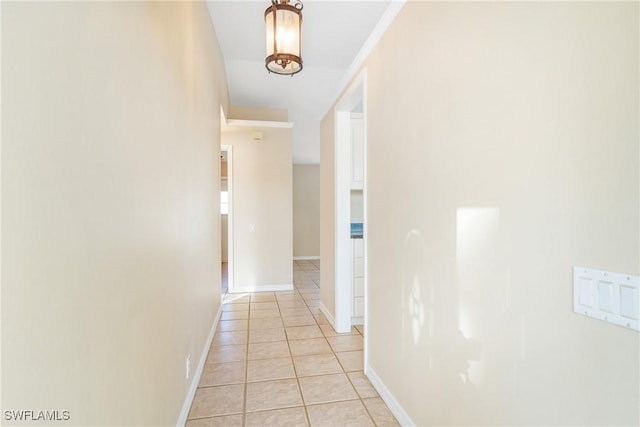 corridor with light tile patterned floors