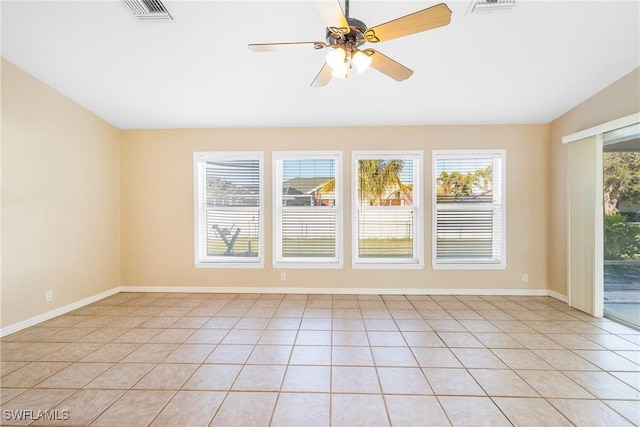 unfurnished room featuring light tile patterned floors and ceiling fan