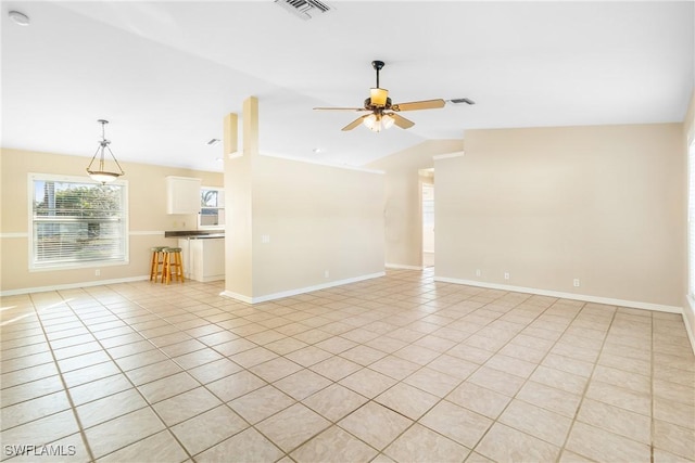 unfurnished living room with lofted ceiling, light tile patterned floors, and ceiling fan