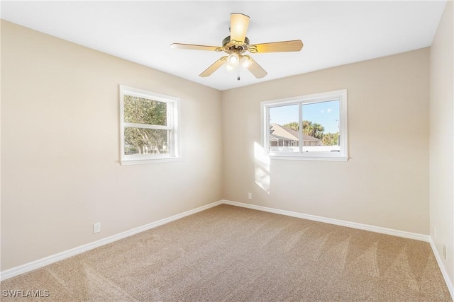 carpeted empty room with ceiling fan