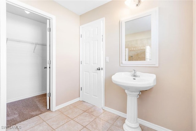 bathroom with tile patterned floors