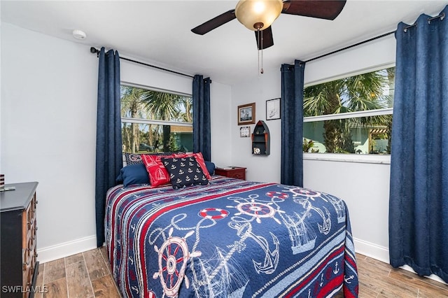 bedroom featuring wood-type flooring and ceiling fan